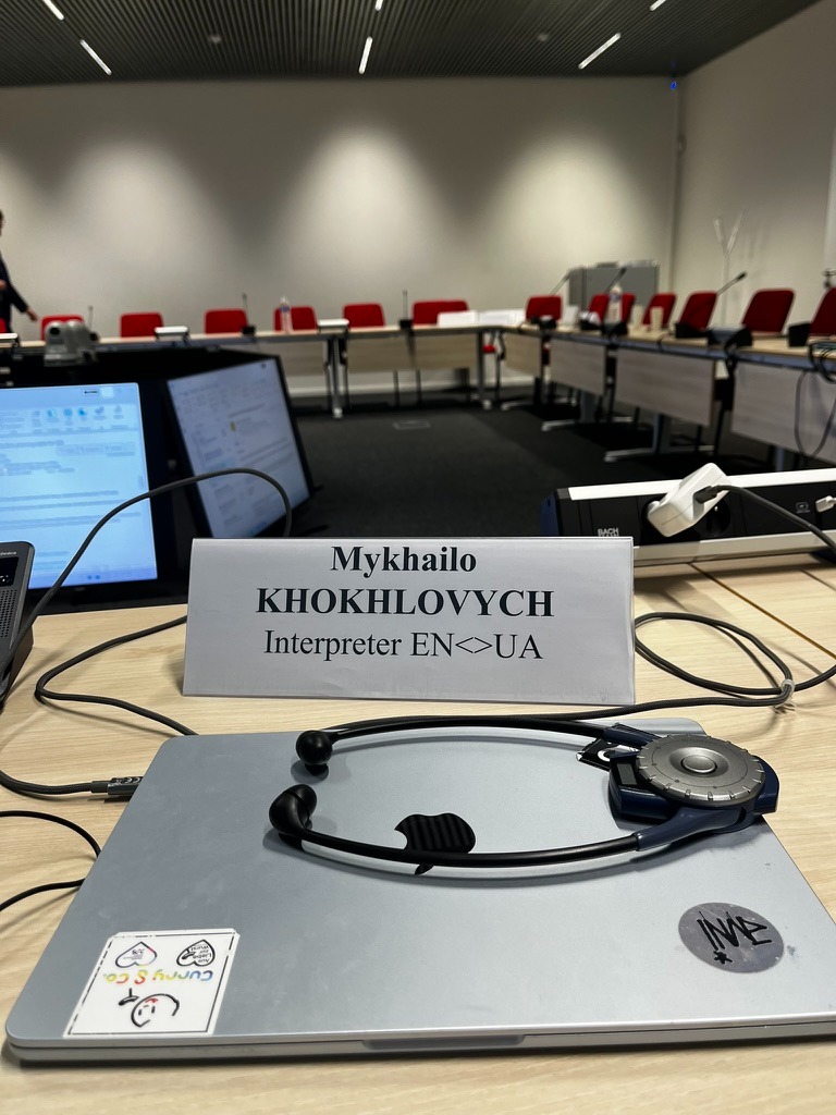 Interpreter desk nameplate: Mykhailo Khokhlovych, Interpreter EN<>UA